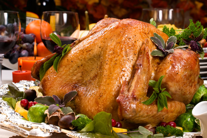 Roasted turkey on a festive table setting.