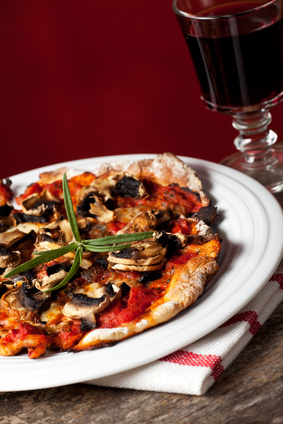 Pizza with mushrooms and red wine.