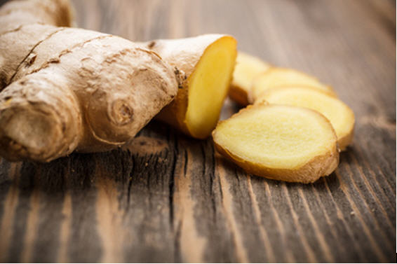 Fresh ginger root and sliced pieces.