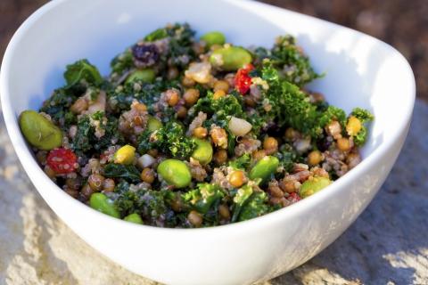 Bowl of quinoa and kale salad.